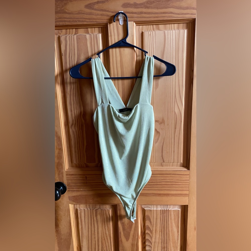Light green bodysuit, size medium, Saints 21 brand.